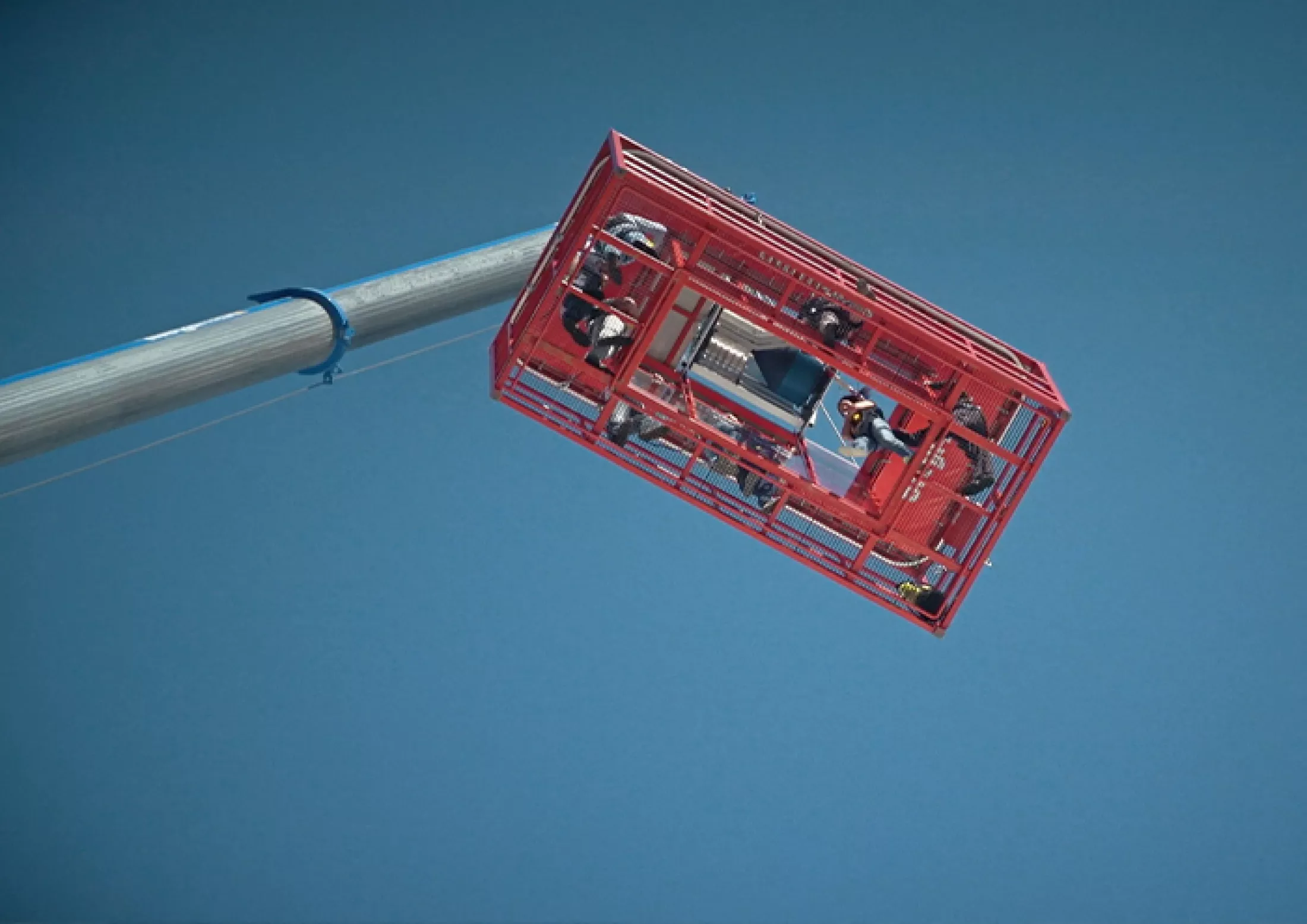 Een werkbak van een kraan langs vanonder.